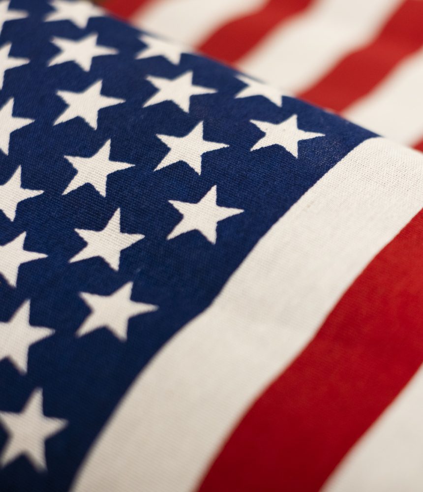 Here's an alt tag for the image: American flag, stars and stripes closeup.